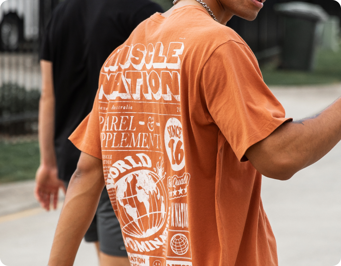 Close up image of the back of a Mens vintage Muscle Nation tee shirt.